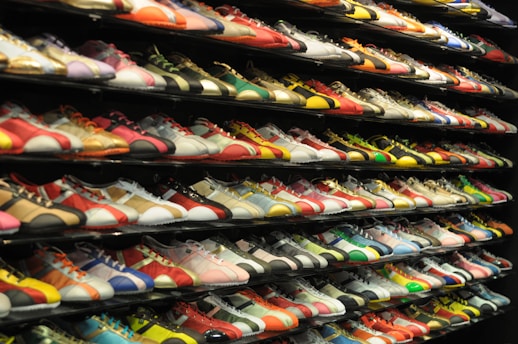 a rack of tennis shoes in a store