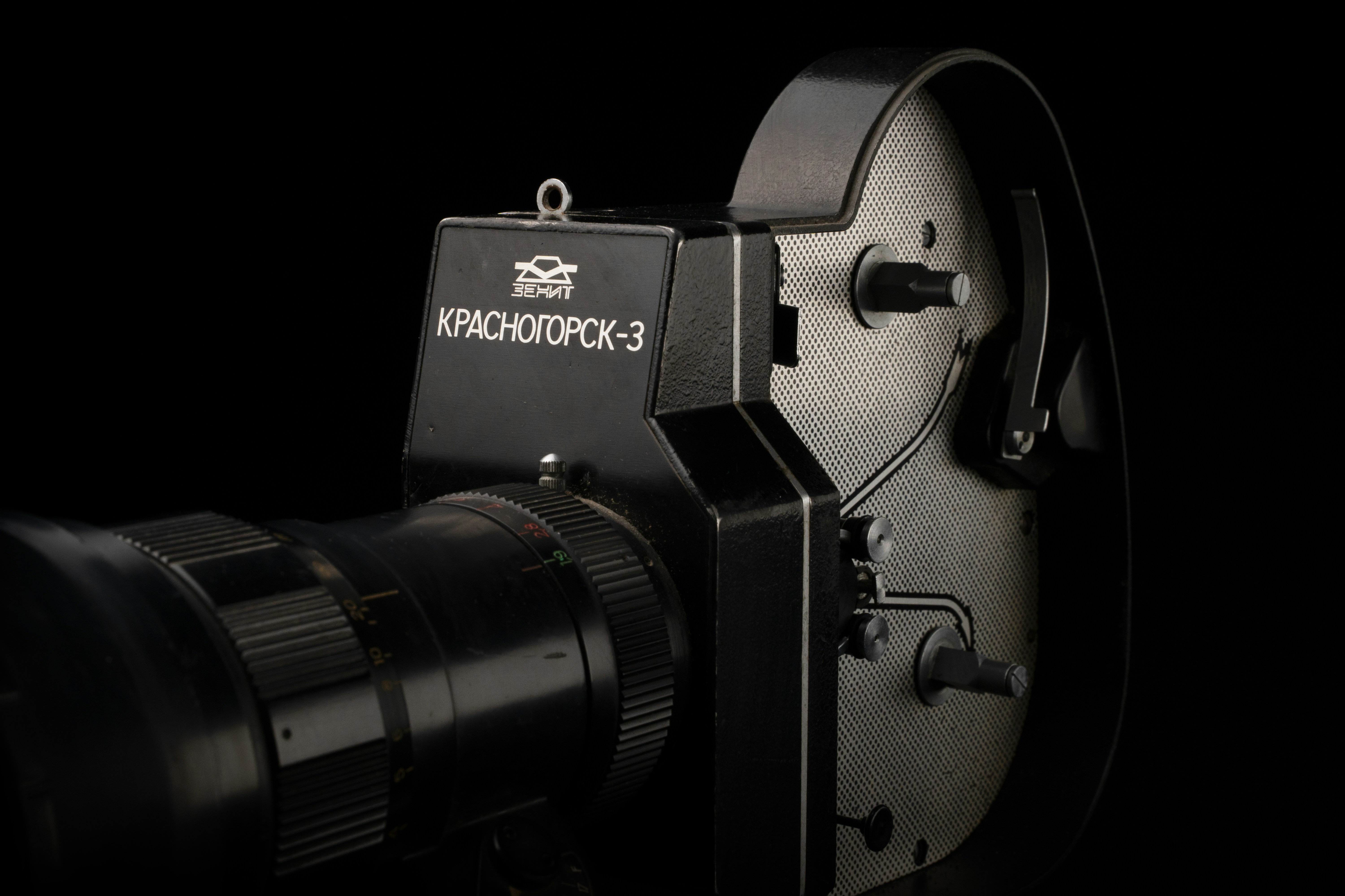 a close up of a camera on a black background