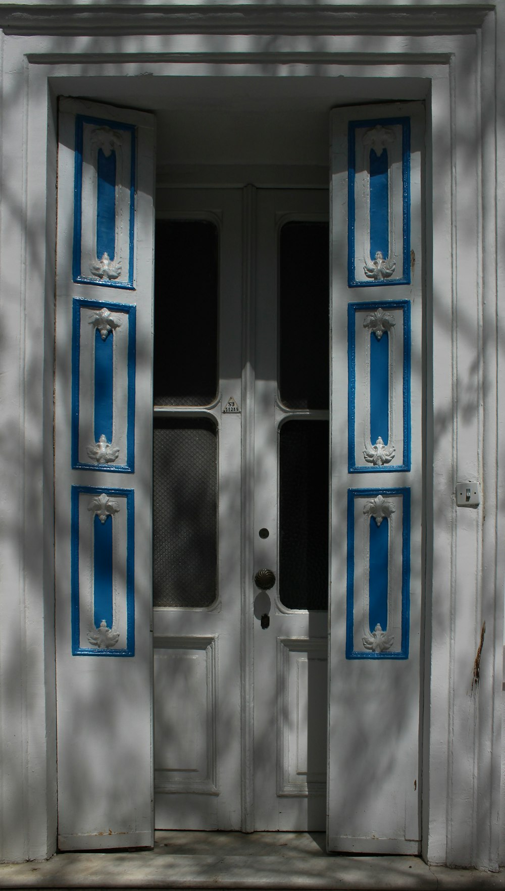 a white door with blue stripes on it