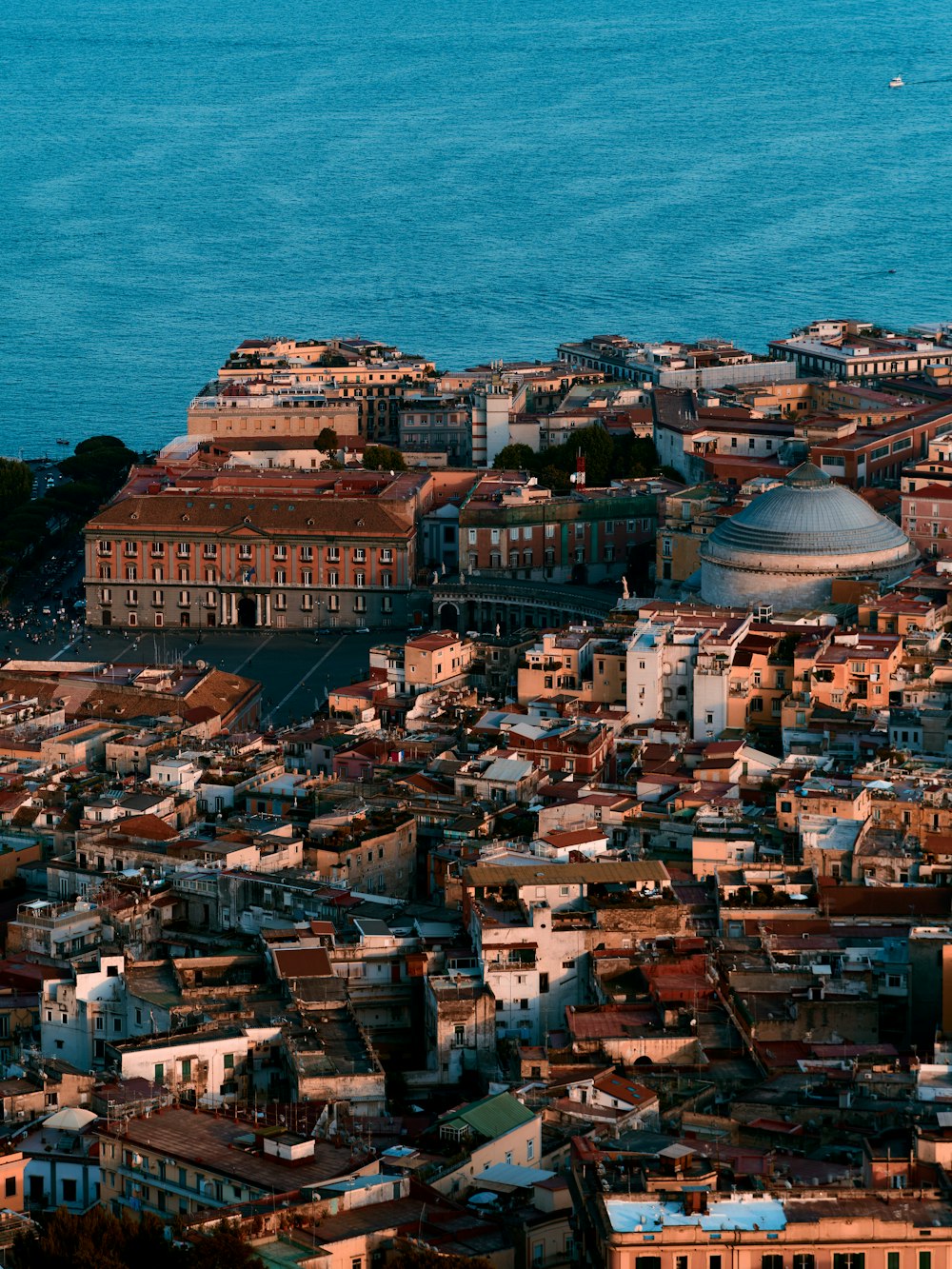 a view of a city with a large body of water in the background