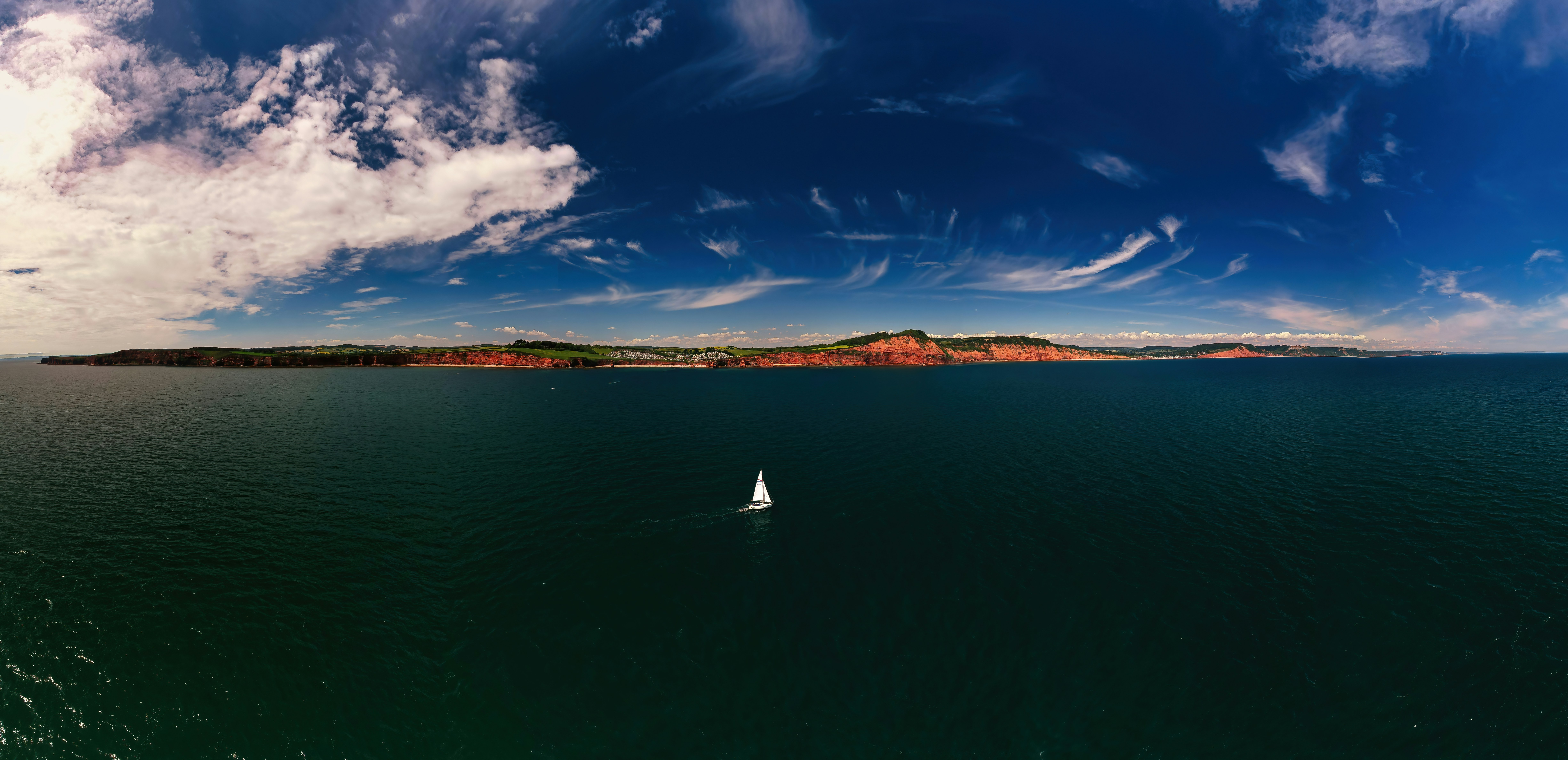 a sailboat in the middle of a large body of water