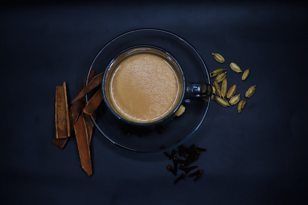 a cup of coffee sitting on top of a saucer