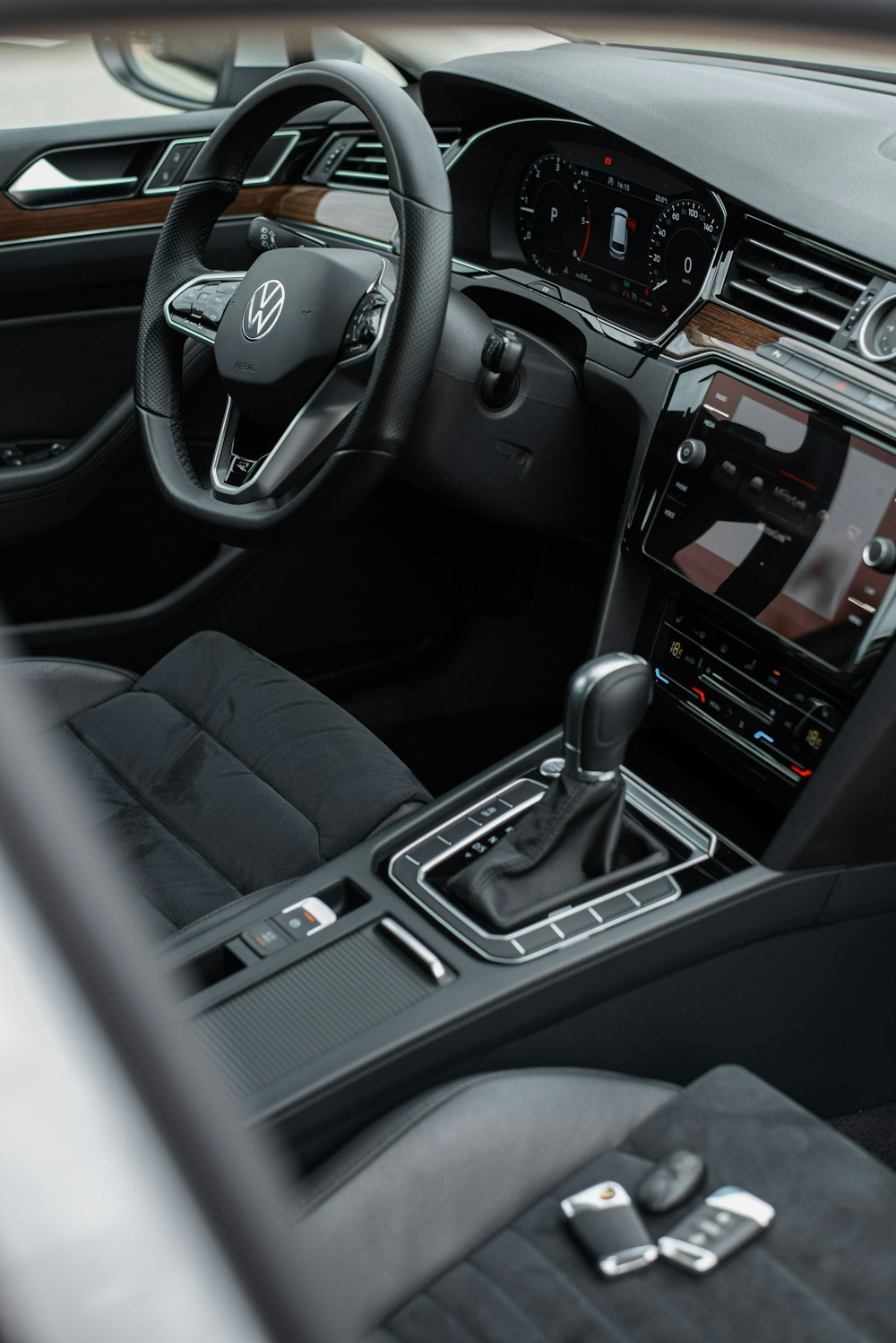 the interior of a car with a steering wheel and dashboard