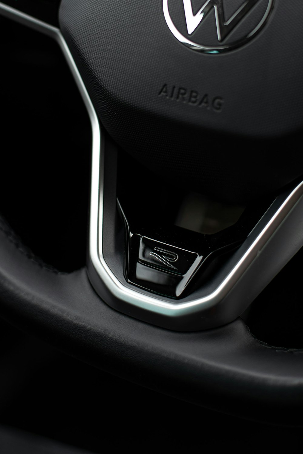 a close up of a steering wheel of a car