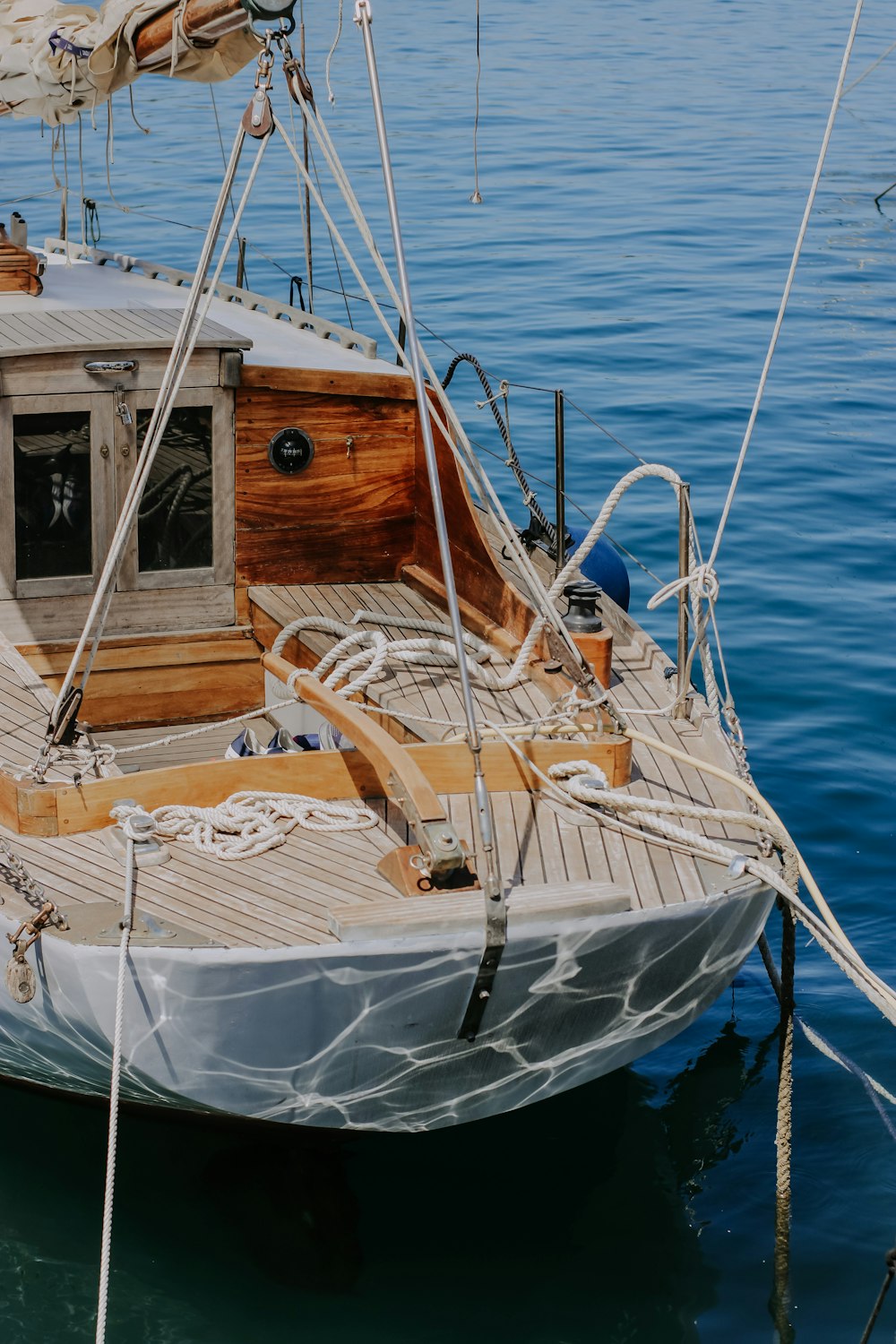 a sailboat docked in a body of water