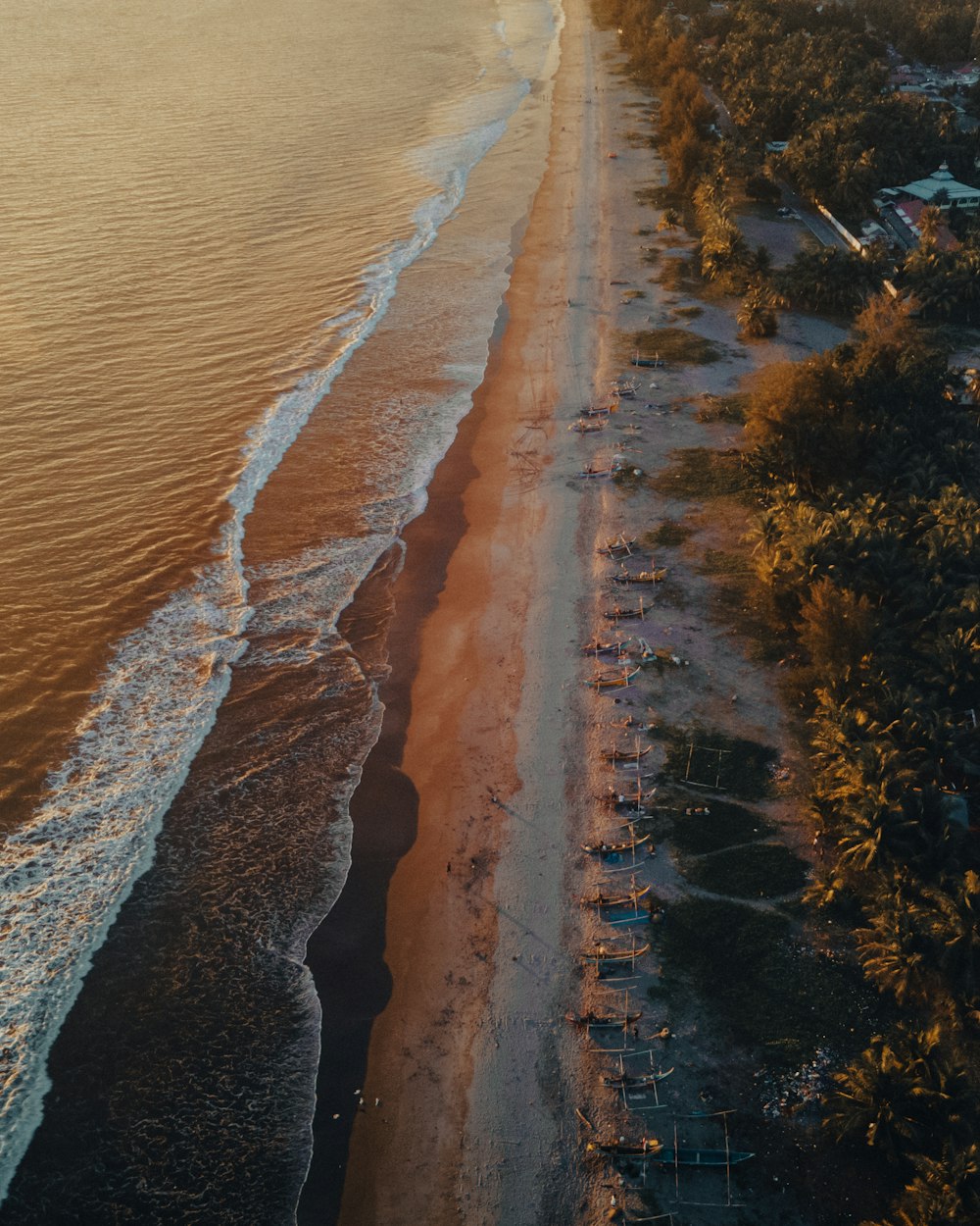 an aerial view of a sandy beach and ocean