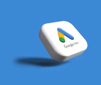 a white google logo on a blue background