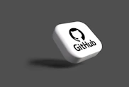a white dice with a black github logo on it