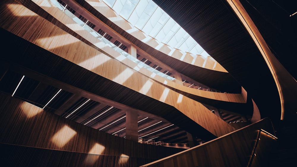 a spiral staircase in a building with lots of windows