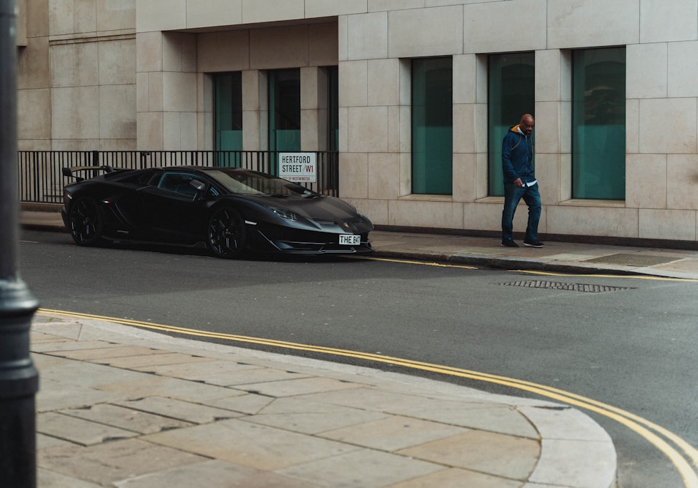 a black sports car parked on the side of the road