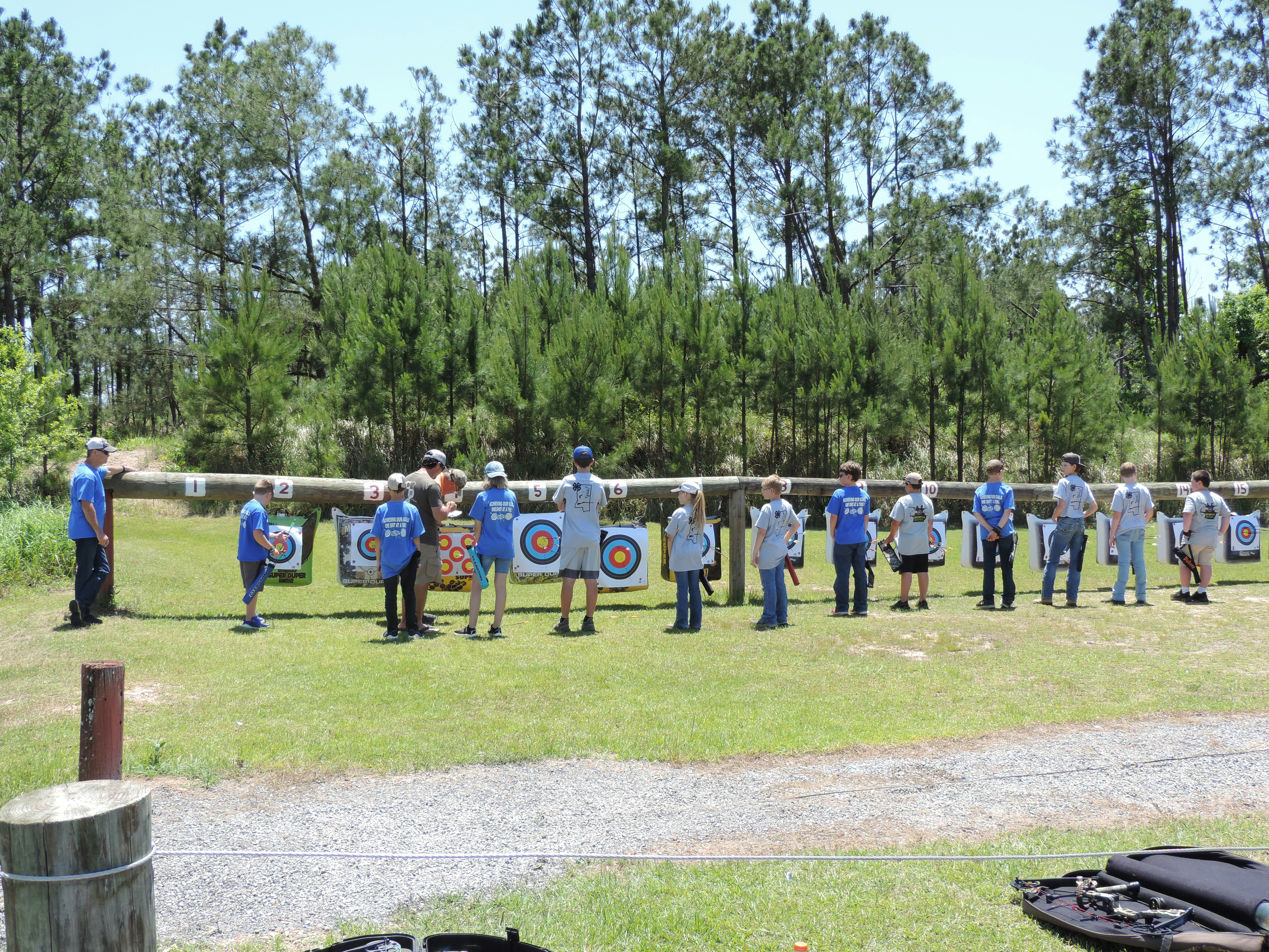 a group of people standing around each other holding bulls