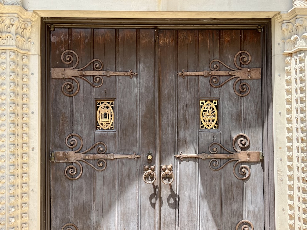 a close up of a wooden door with a clock on it