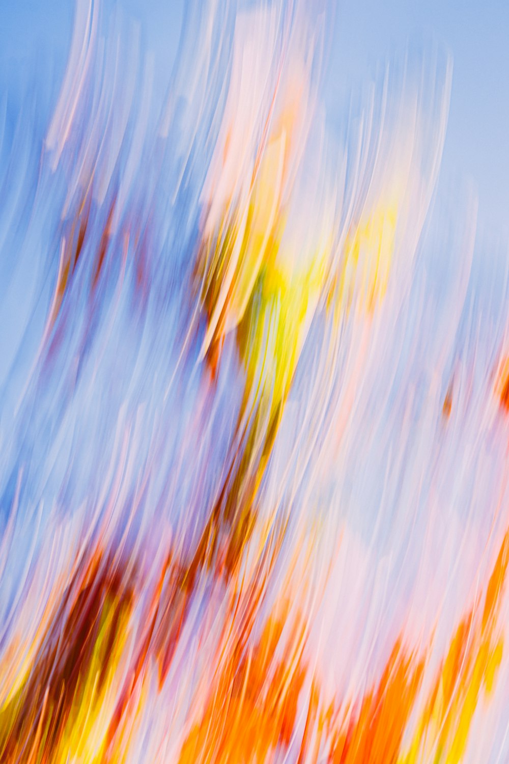 a blurry photo of a fire hydrant in front of a blue sky