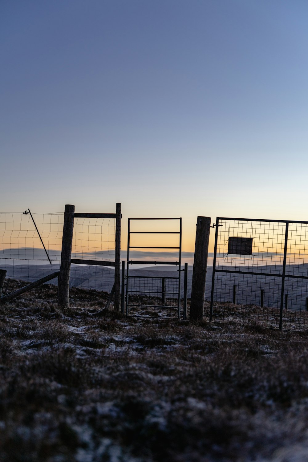 a fence with a gate on top of it