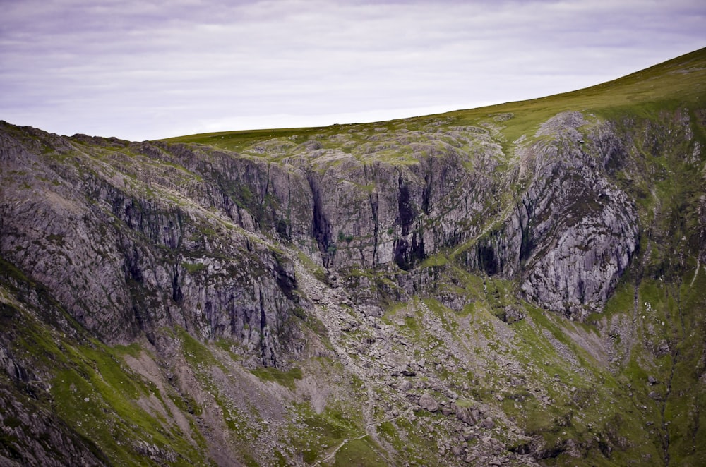 a very tall mountain with a very steep side