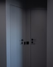 Modern minimalist interior showing multiple deli smartlocks installed on various doors