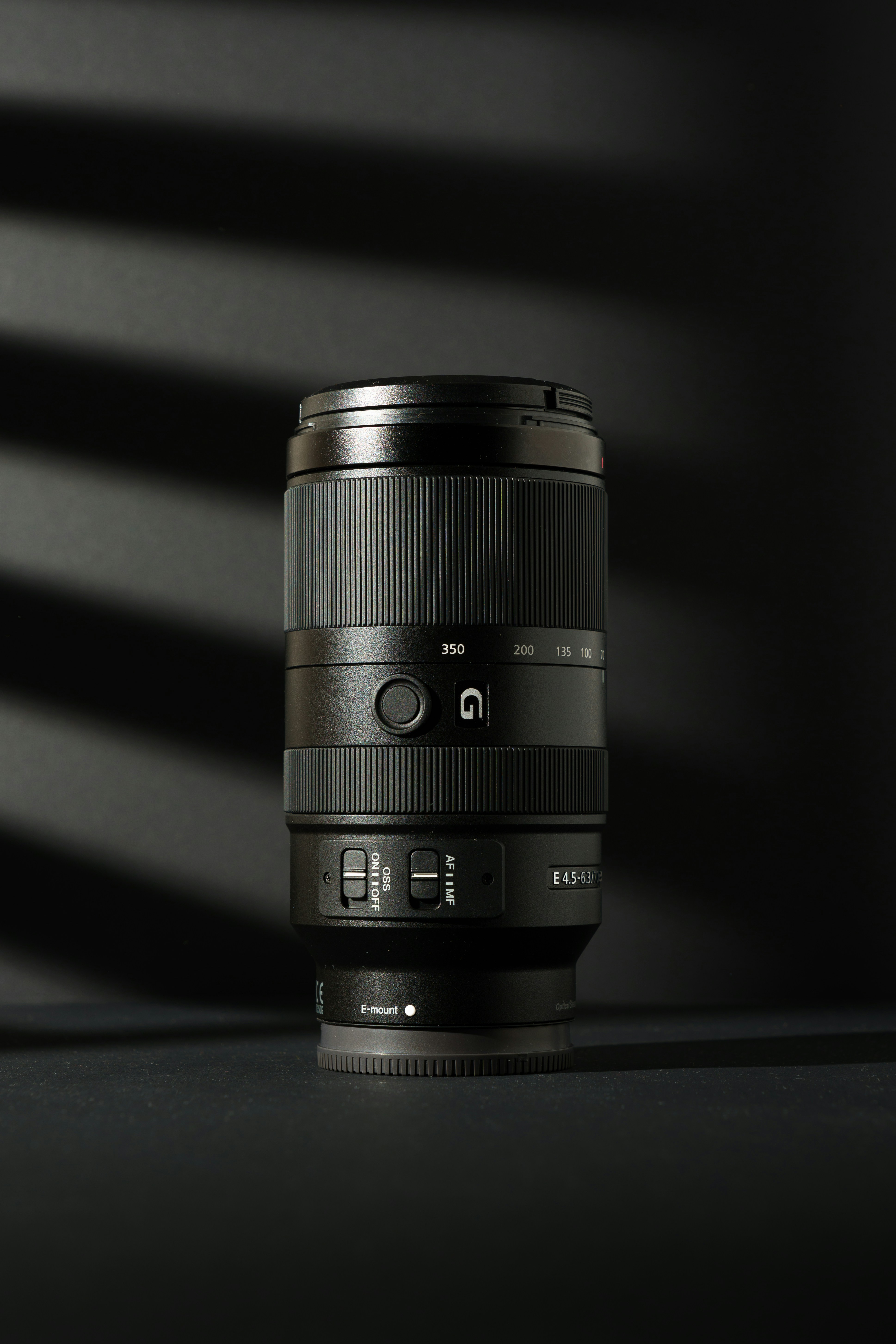A camera lens sitting on top of a table photo Free Grey Image on Unsplash