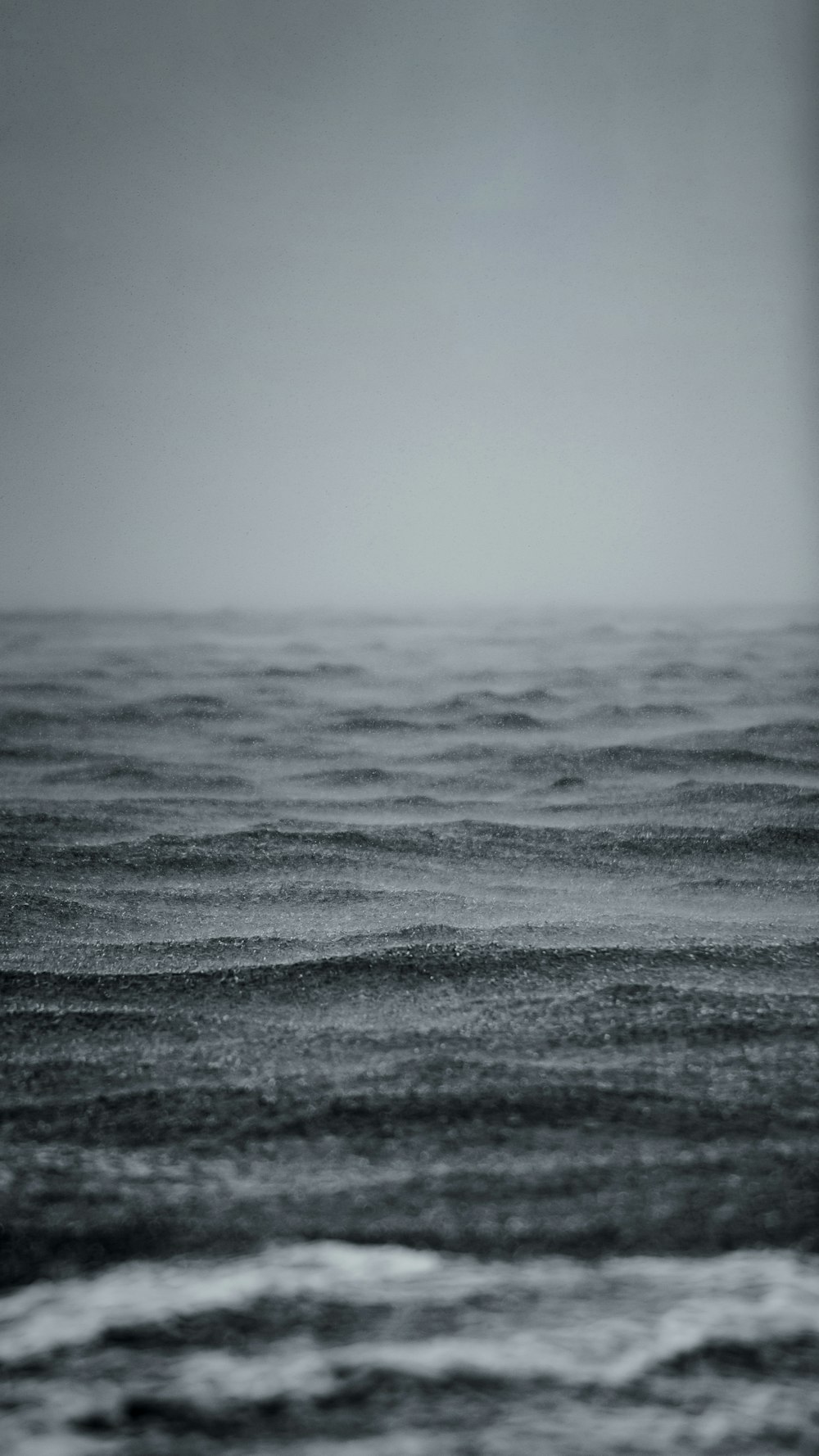 a black and white photo of the ocean