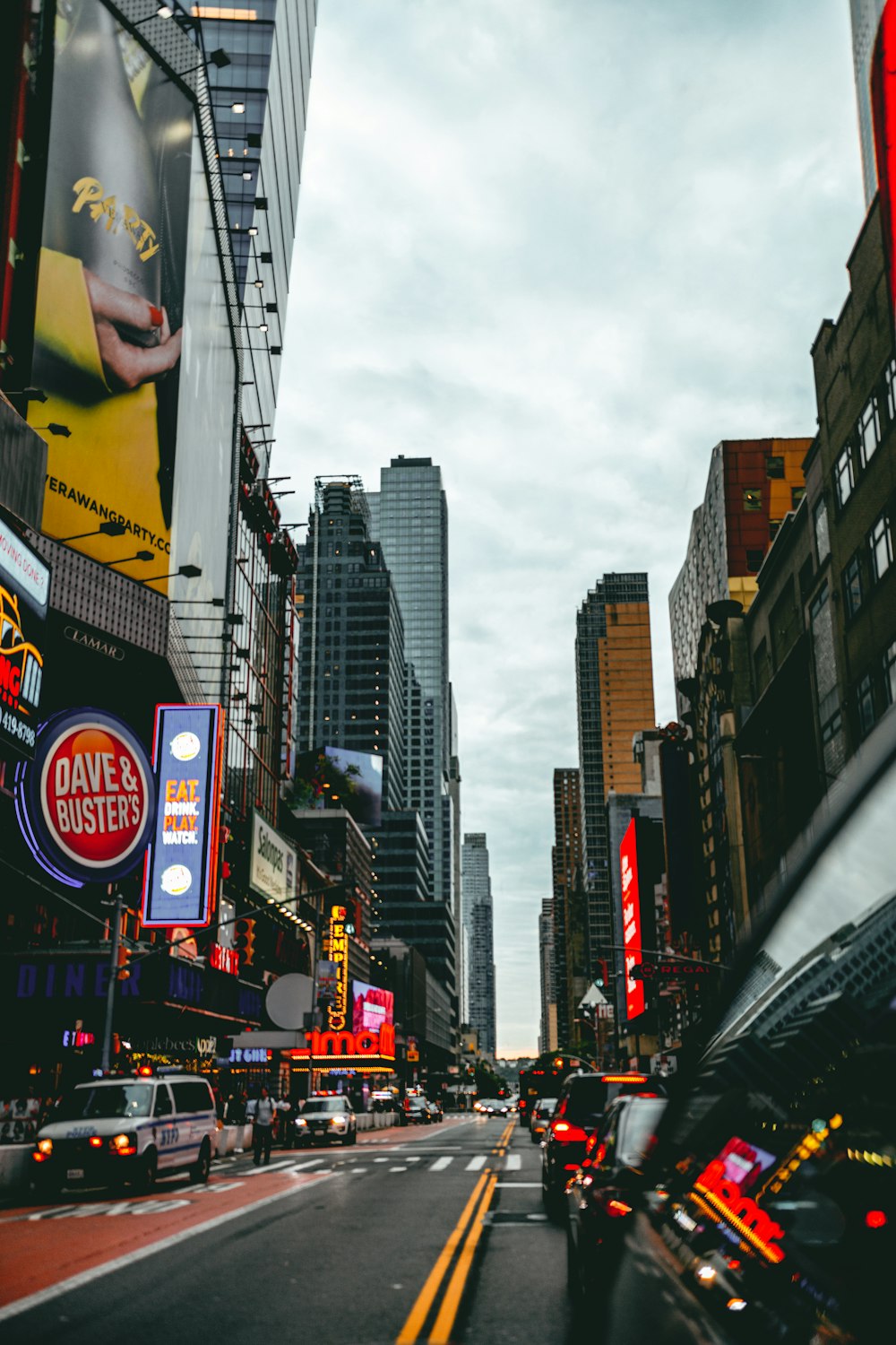 a city street filled with lots of tall buildings