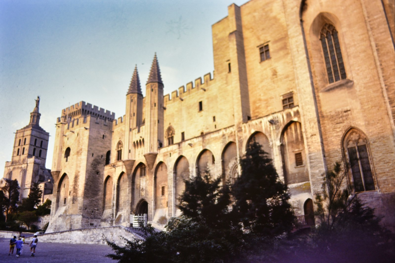 The Gothic towers, pointed turrets and tall arches of the Palais des Papes in Avignon