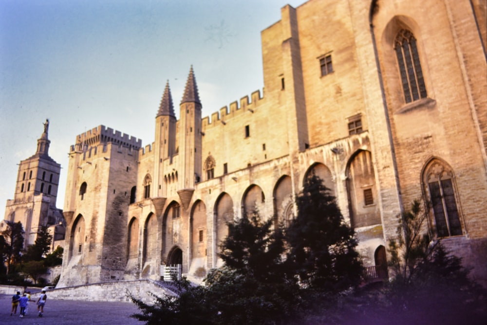 a large building with many windows and towers