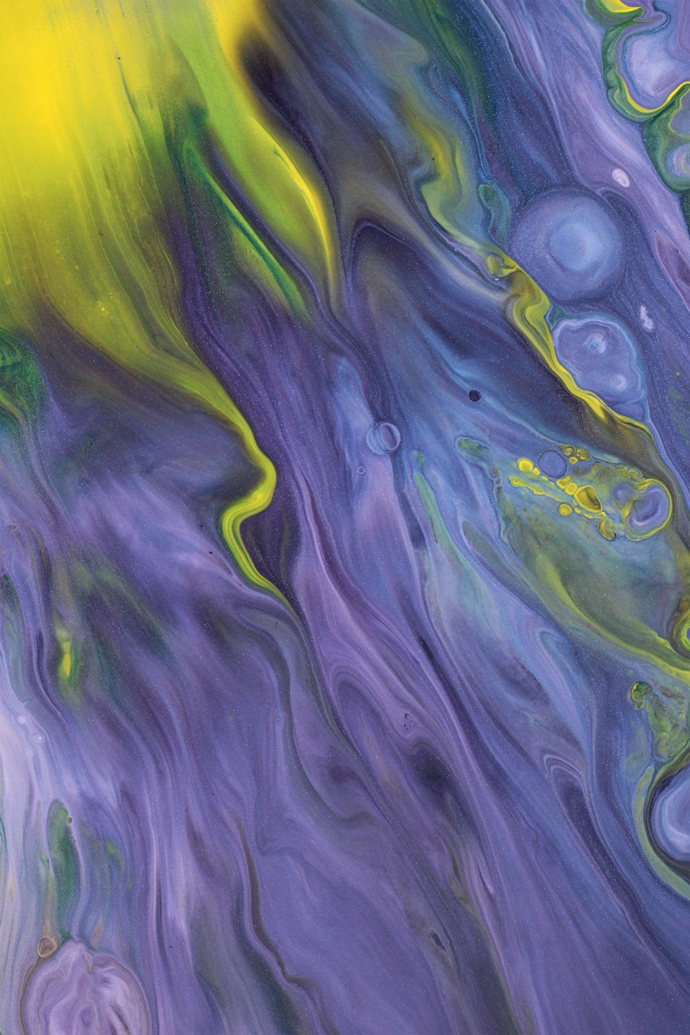 an abstract painting of blue, yellow, and green colors