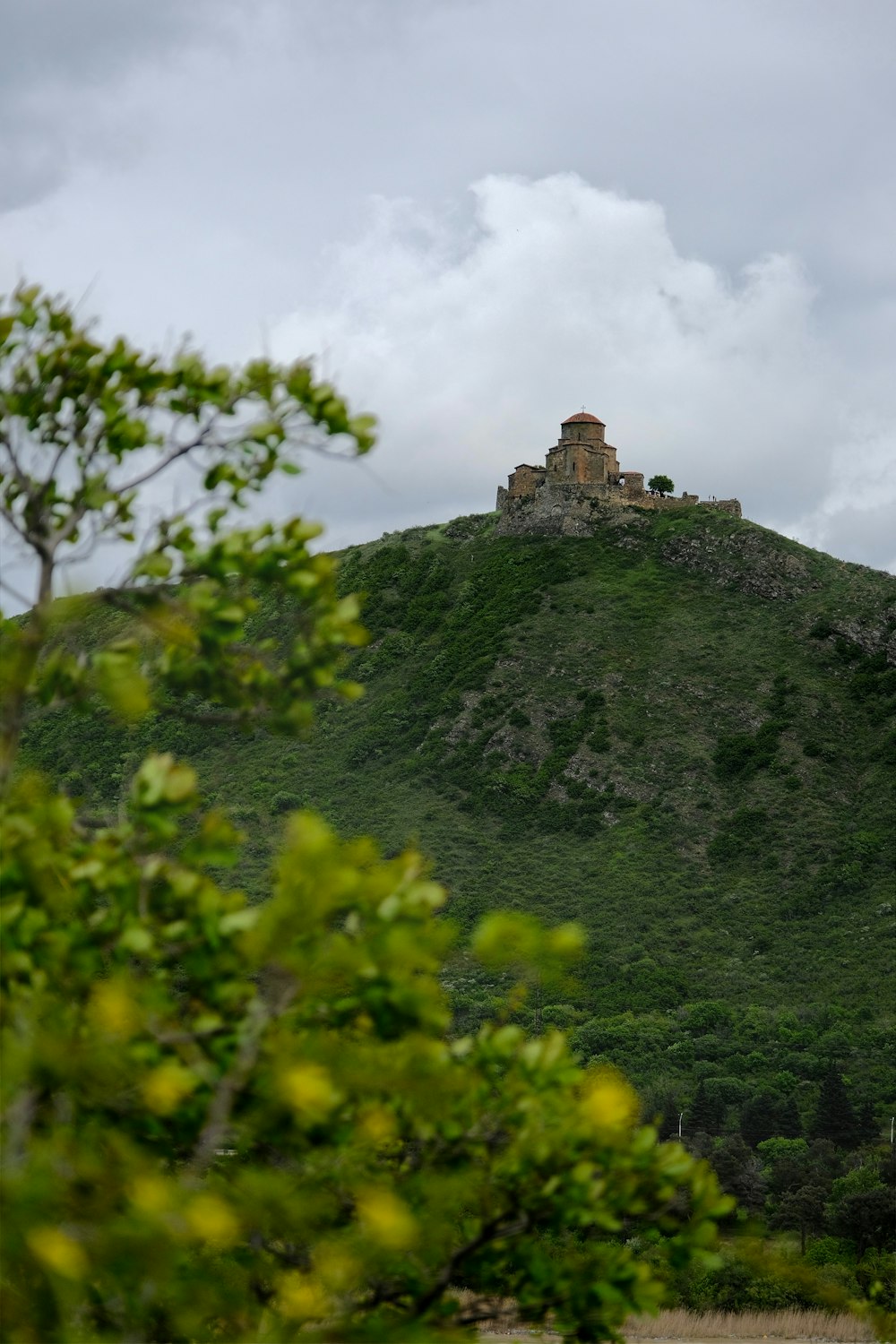 a hill with a castle on top of it