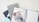 A collection of stationary items including a monthly planner, a bullet journal, a decorative notebook, and a pen. The arrangement is on a light, clean surface, featuring a combination of both minimal and artistic designs.