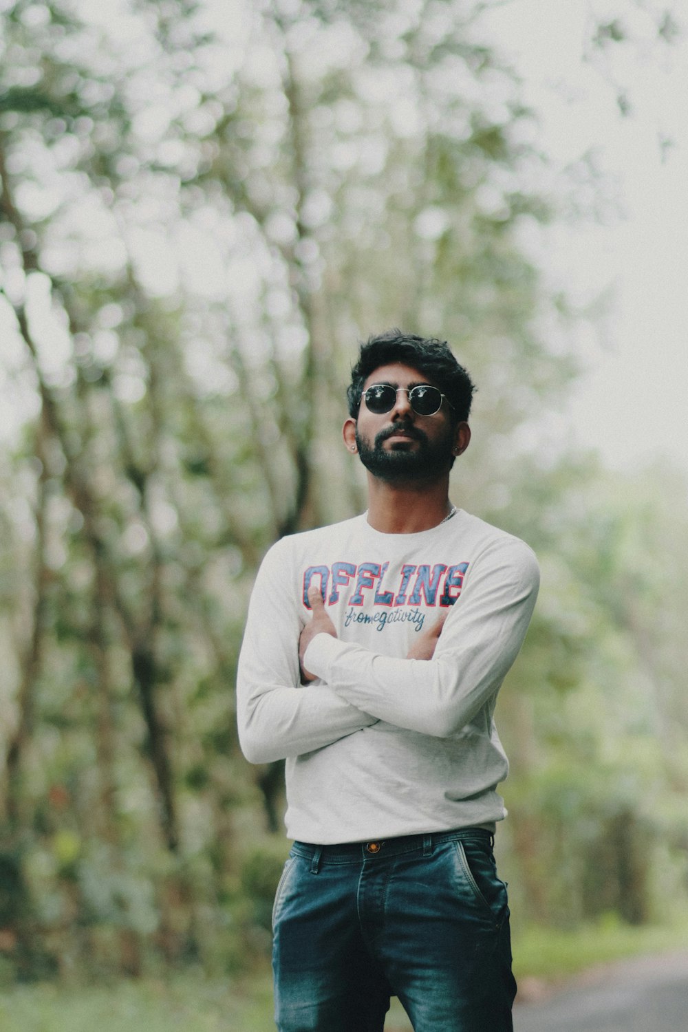 a man standing on the side of a road