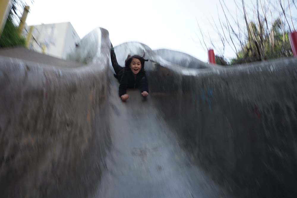 a person riding a skate board on a ramp