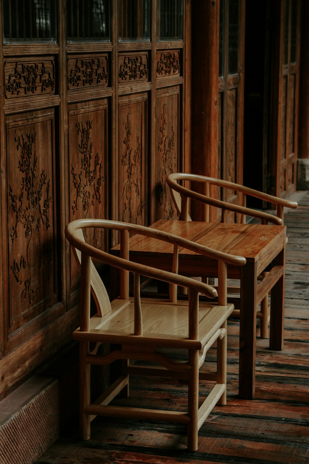 a couple of wooden benches sitting next to each other