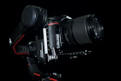 Close-up of a Nikon Z8 camera mounted on a gimbal inside a van, ready for filming.
