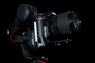 Close-up of a Nikon Z8 camera mounted on a gimbal inside a cozy van setup.