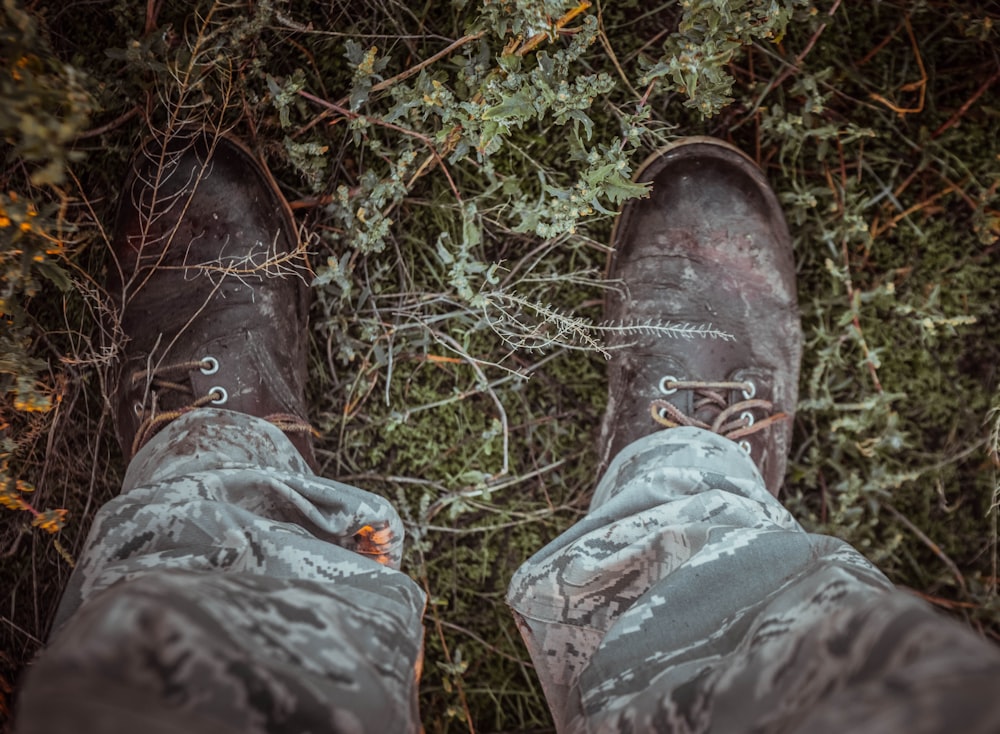 a pair of shoes standing in the middle of a forest