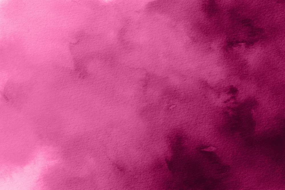 a watercolor painting of a pink cloud