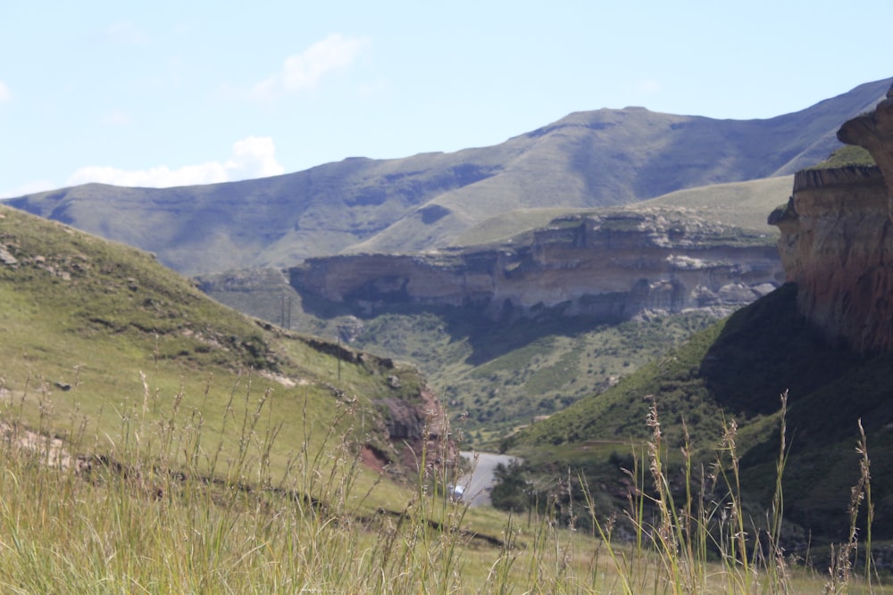 a view of a valley with mountains in the background