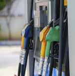 a row of gas pumps filled with gas
