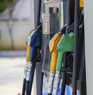 a row of gas pumps filled with gas