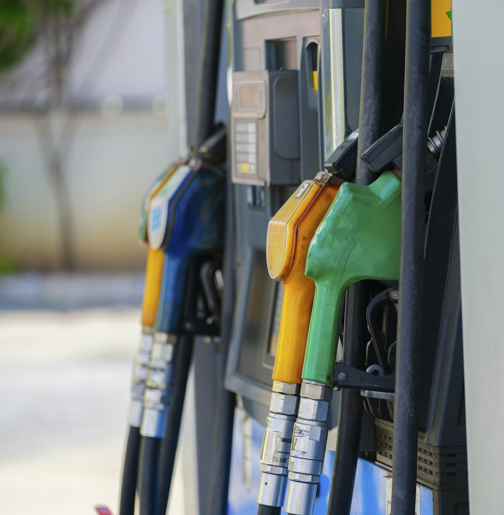 a row of gas pumps filled with gas