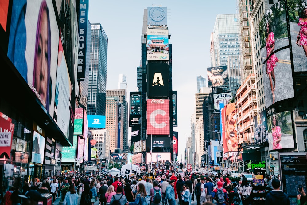 a crowded city street filled with lots of people