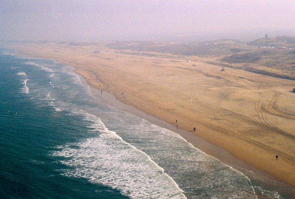 an aerial view of a beach and ocean