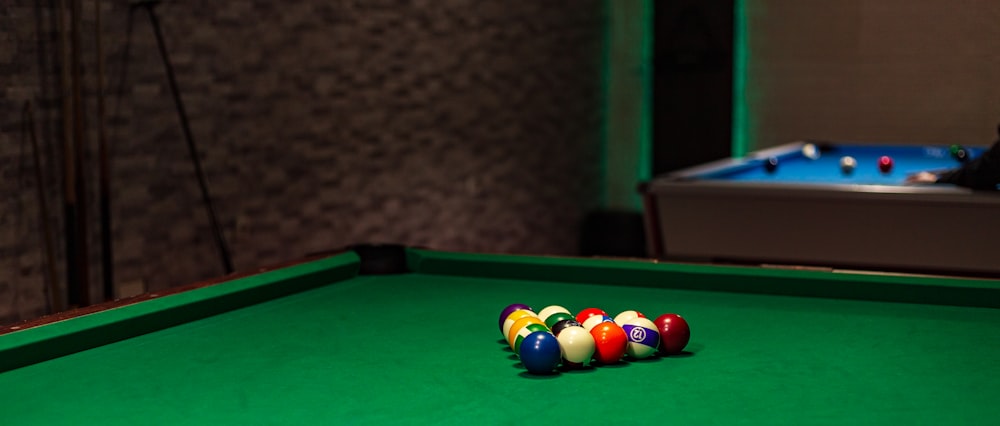 a pool table with several pool balls on it