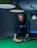 a man playing pool in a dark room