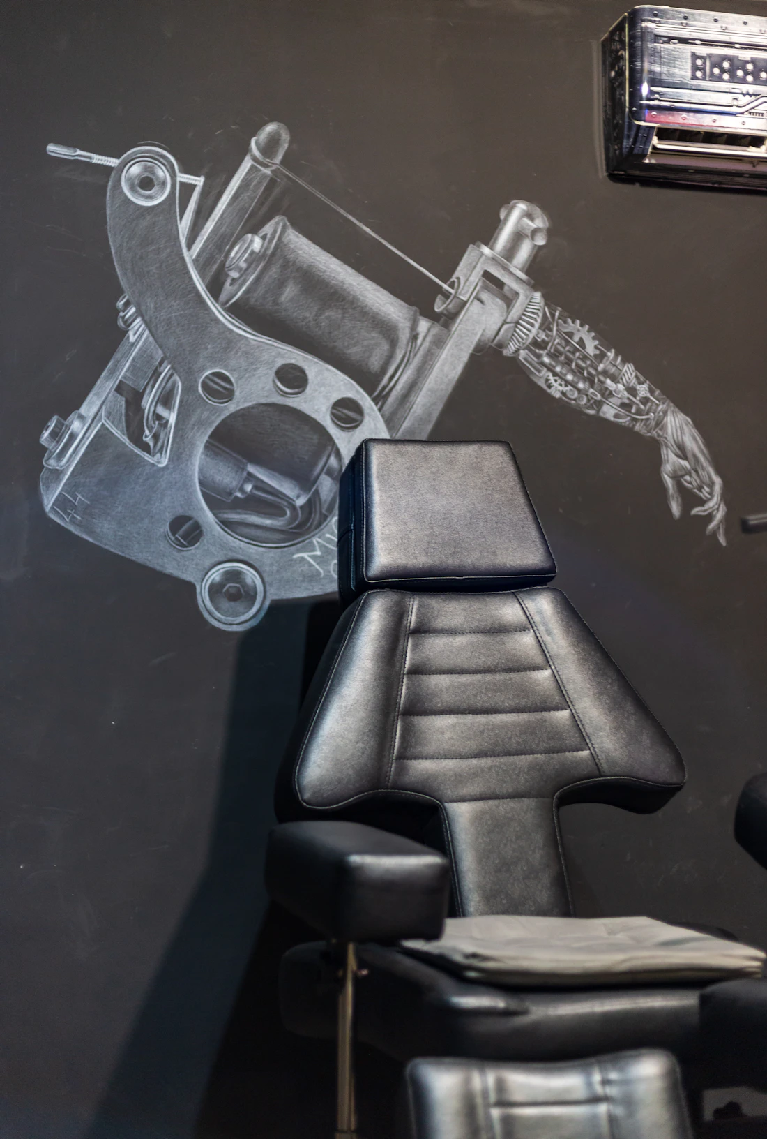 A clean, private tattoo studio with a single chair.