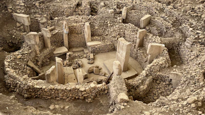 The excavated stone pillars of Göbekli Tepe under their canopy