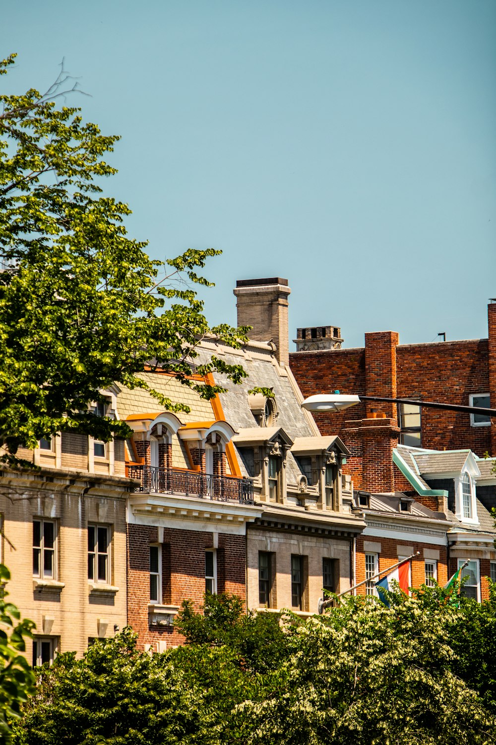 a view of a building with a clock tower in the background