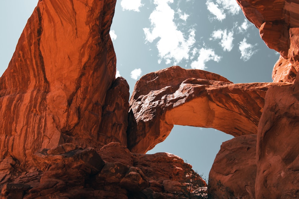 a large rock formation with a sky in the background