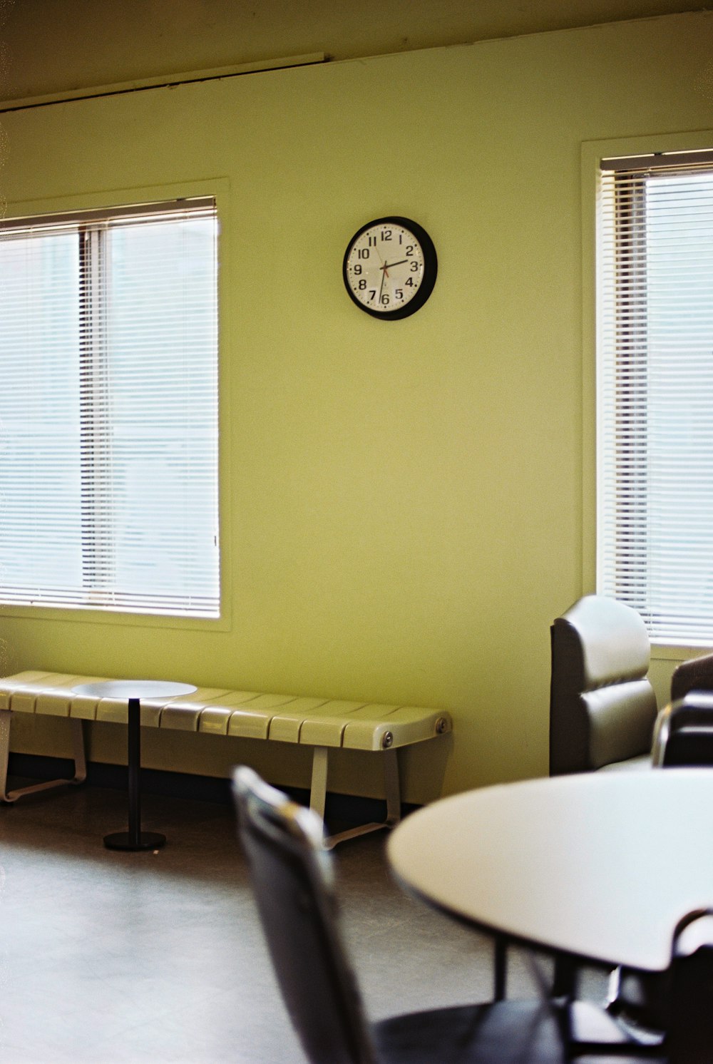 a clock on the wall of a waiting room