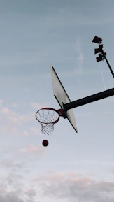 Dynamic shot of a basketball player mid-air, showcasing sports photography skills.