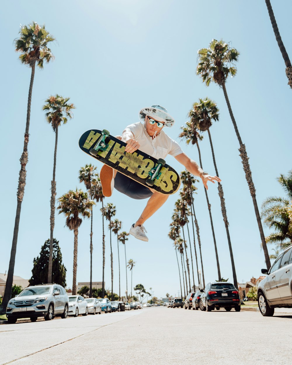 a man flying through the air while riding a skateboard